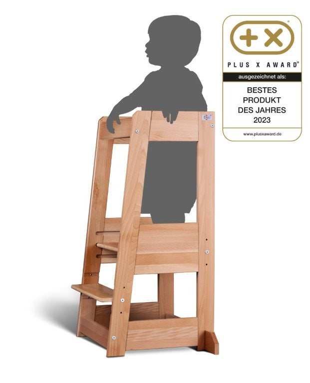Natural wood learning tower Felix with child silhouette and Plus X Award Best Product of the Year 2023 badge