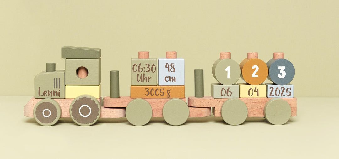Wooden toy farm train with personalized name and birth details, designed for creative play and motor skills development.