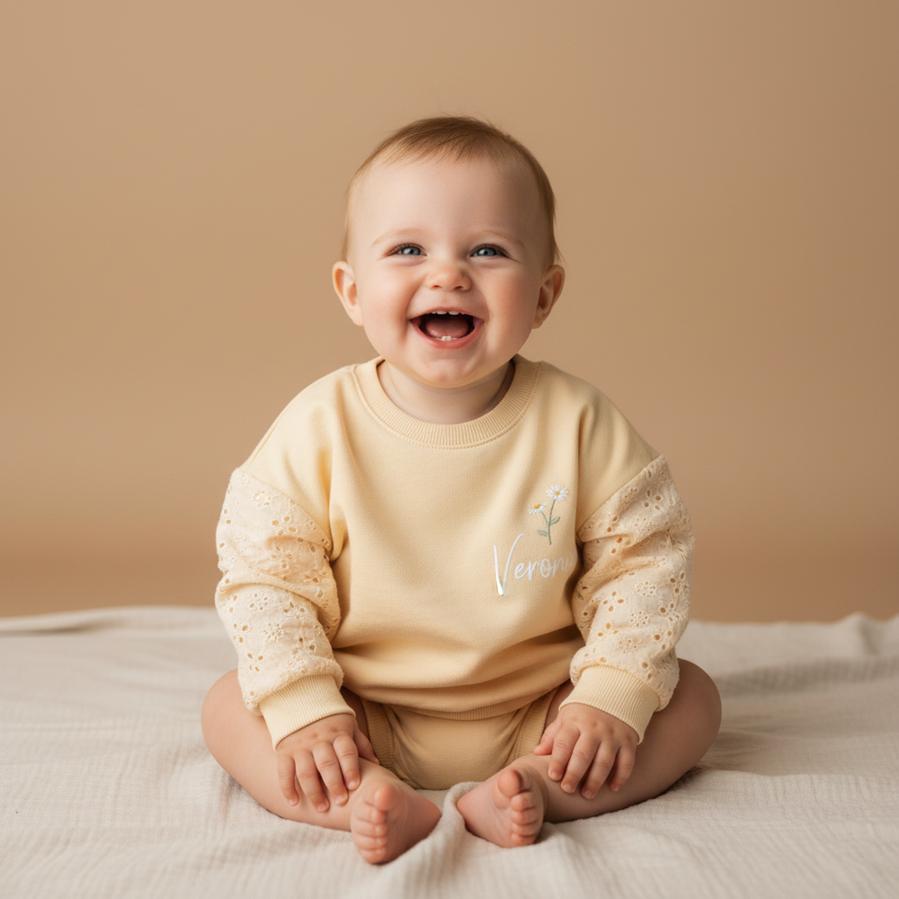 Personalized baby clothes, including rompers or sweaters with names