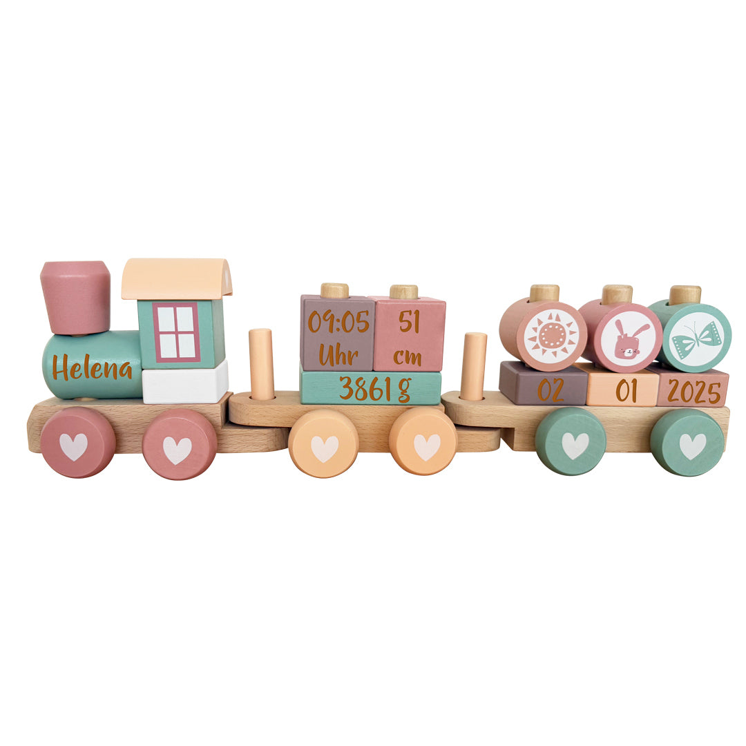 Personalisierter Holz-Zug zur Geburt in Rosa und Pink