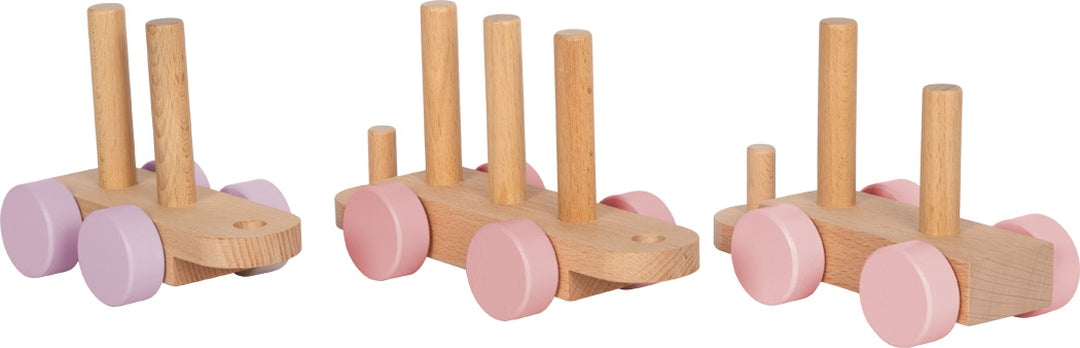 Rosa Holzzug aus Holz mit Lok und zwei Waggons zum Aufstecken der Bausteine
