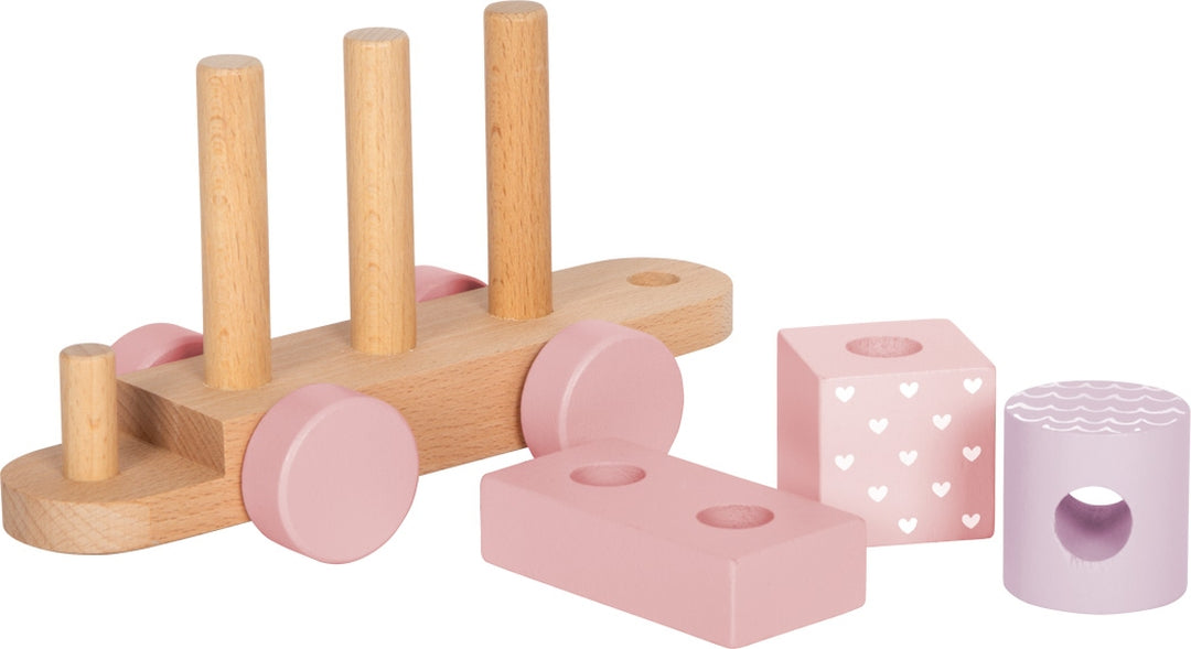 Rosa Holzzug mit abnehmbaren Steckelementen und Holzbausteinen zum Stapeln und Bauen